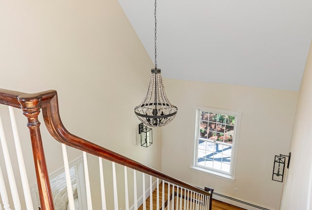 interior details featuring baseboard heating and wood-type flooring