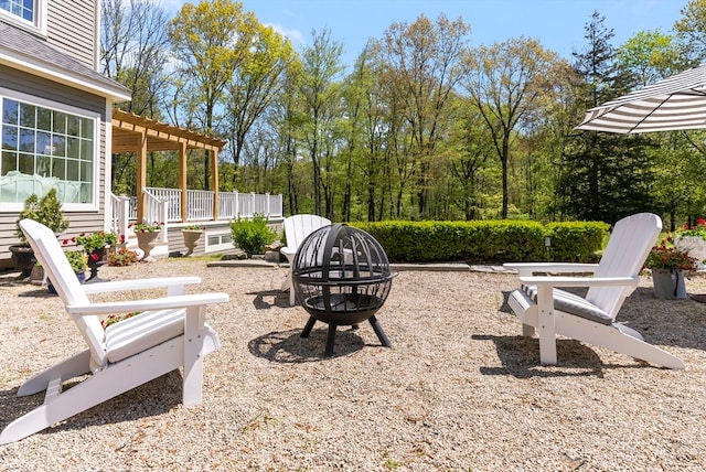 view of patio / terrace featuring a pergola and a fire pit