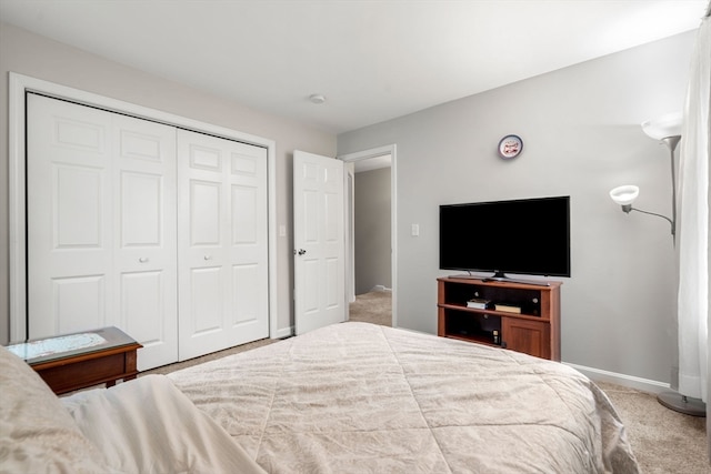 bedroom featuring a closet and carpet