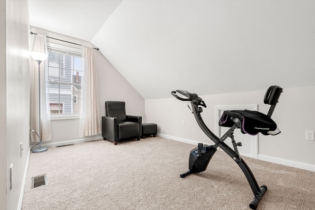 exercise area with vaulted ceiling and carpet floors