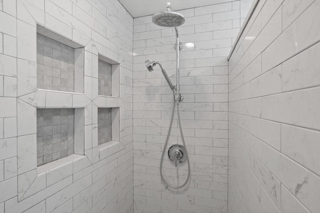full bath with a tile shower