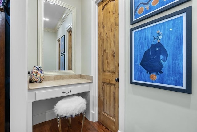 mudroom with dark wood-style flooring and ornamental molding
