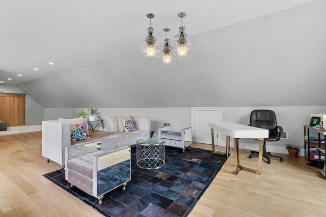 interior space with baseboards, vaulted ceiling, recessed lighting, and wood finished floors