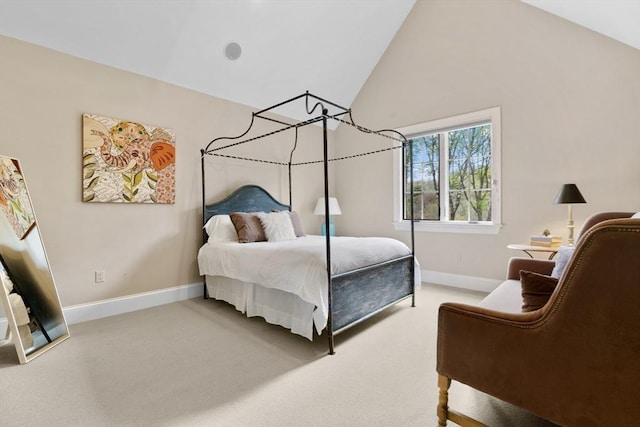 bedroom with baseboards, lofted ceiling, and light colored carpet