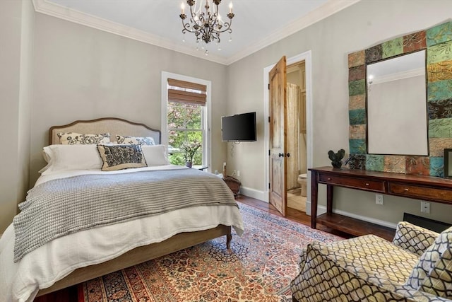 bedroom featuring crown molding, wood finished floors, baseboards, ensuite bath, and a notable chandelier