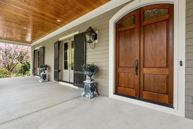 property entrance with french doors and covered porch