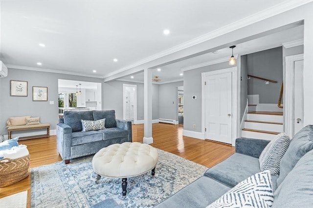 living area featuring stairway, baseboards, recessed lighting, and wood finished floors