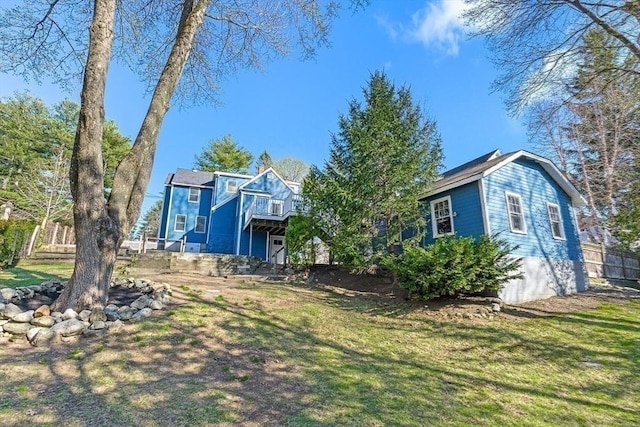 view of yard featuring fence and a deck