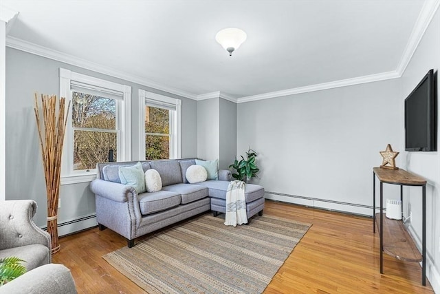 living area featuring crown molding, a baseboard radiator, and wood finished floors