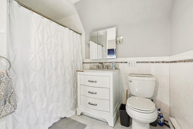 bathroom featuring toilet, tile walls, a shower with curtain, vanity, and tile patterned flooring