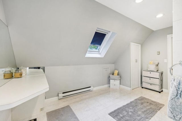 bathroom with baseboards, lofted ceiling with skylight, a baseboard heating unit, and recessed lighting