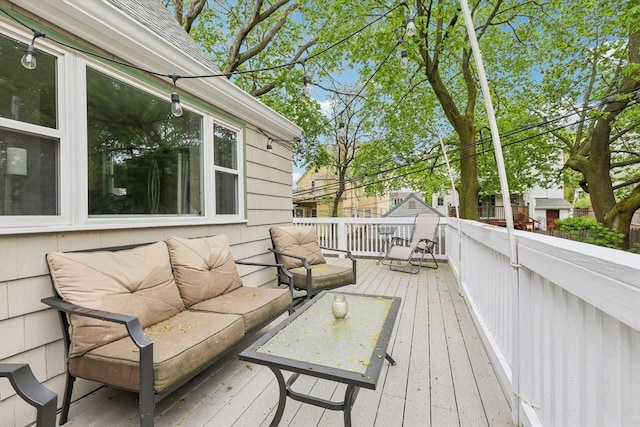 wooden terrace featuring an outdoor hangout area