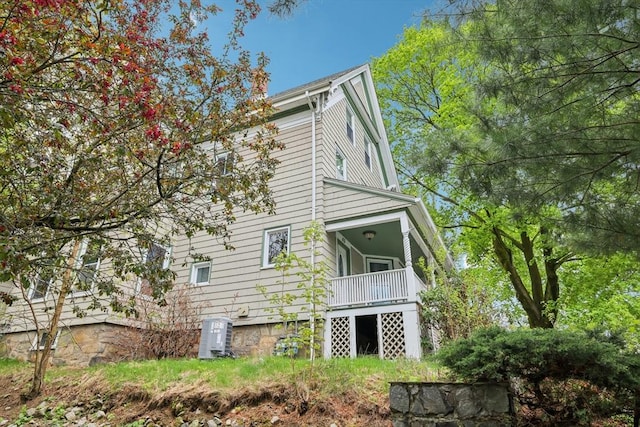rear view of house with central air condition unit