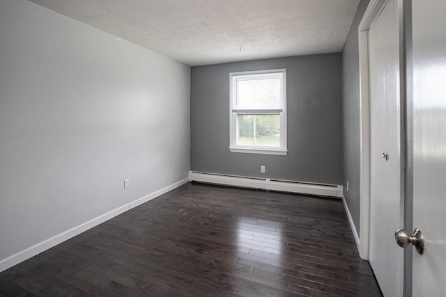 139 Barneyville Rd, Swansea, MA 02777 - unfurnished room featuring baseboard heating, dark wood-style flooring, a textured ceiling, and baseboards