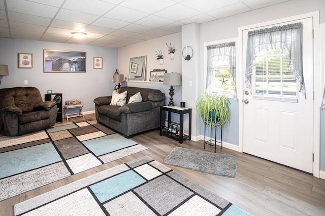 139 Barneyville Rd, Swansea, MA 02777 - living area featuring wood finished floors, baseboards, and a paneled ceiling