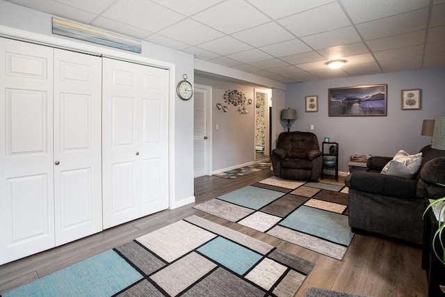 139 Barneyville Rd, Swansea, MA 02777 - living room featuring a drop ceiling, wood finished floors, and baseboards