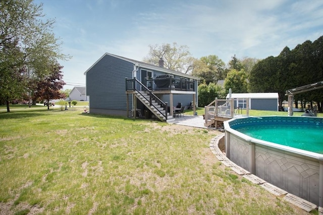 139 Barneyville Rd, Swansea, MA 02777 - outdoor pool with stairway, a wooden deck, a yard, and an outbuilding