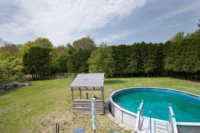 139 Barneyville Rd, Swansea, MA 02777 - outdoor pool featuring a lawn and a wooded view