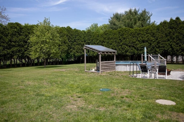 139 Barneyville Rd, Swansea, MA 02777 - view of green lawn with an outdoor pool and a gazebo