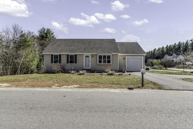1 Lois Ln, Townsend, MA 01469 - single story home featuring an attached garage, a shingled roof, a front lawn, and aphalt driveway