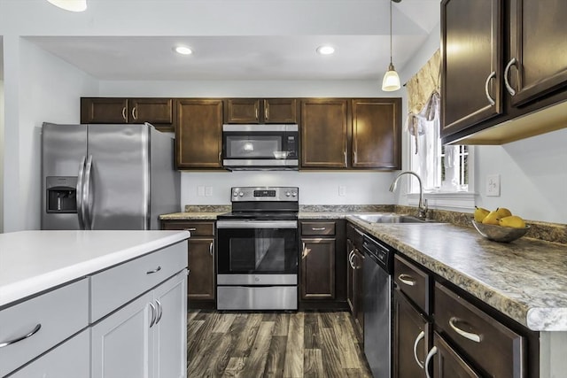 1 Lois Ln, Townsend, MA 01469 - kitchen with dark brown cabinetry, dark wood-style floors, recessed lighting, a sink, and appliances with stainless steel finishes