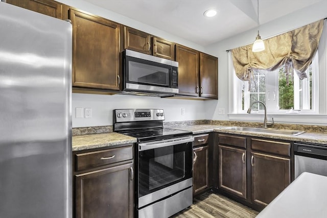 1 Lois Ln, Townsend, MA 01469 - kitchen featuring dark brown cabinets, appliances with stainless steel finishes, and a sink