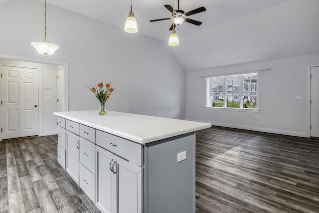 1 Lois Ln, Townsend, MA 01469 - kitchen featuring a ceiling fan, a kitchen island, hanging light fixtures, vaulted ceiling, and dark wood finished floors