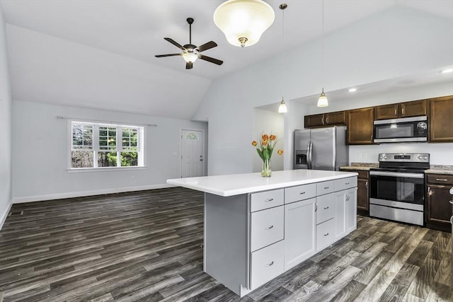 1 Lois Ln, Townsend, MA 01469 - kitchen featuring dark wood-style flooring, appliances with stainless steel finishes, light countertops, open floor plan, and vaulted ceiling