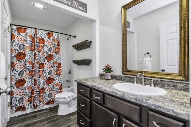 1 Lois Ln, Townsend, MA 01469 - bathroom featuring vanity, wood finished floors, shower / bath combo, and toilet
