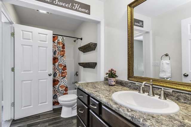 1 Lois Ln, Townsend, MA 01469 - full bathroom featuring vanity, shower / tub combo with curtain, wood finished floors, and toilet