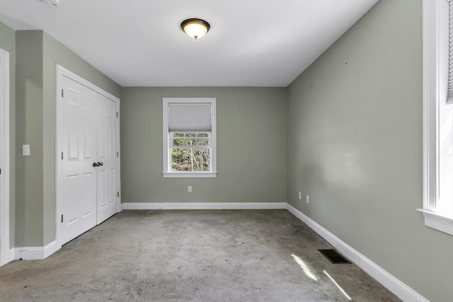 1 Lois Ln, Townsend, MA 01469 - unfurnished bedroom featuring baseboards, visible vents, carpet, and a closet