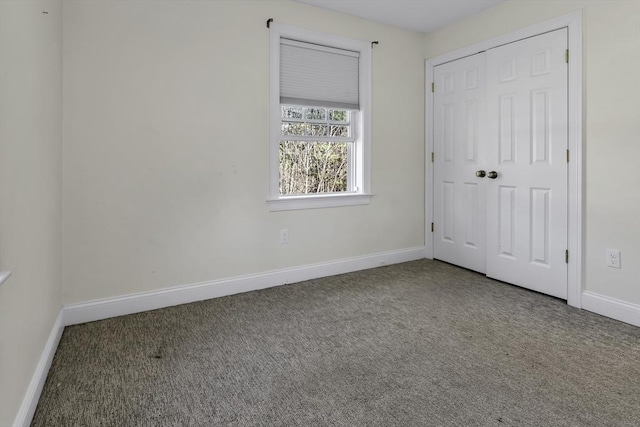 1 Lois Ln, Townsend, MA 01469 - unfurnished bedroom featuring carpet floors, baseboards, and a closet