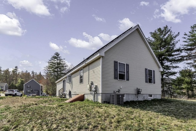 1 Lois Ln, Townsend, MA 01469 - view of side of property with a lawn and central AC