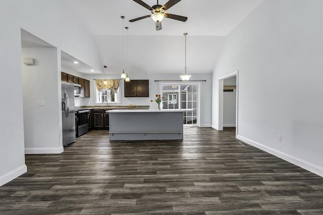 1 Lois Ln, Townsend, MA 01469 - kitchen featuring dark brown cabinetry, stainless steel appliances, a ceiling fan, baseboards, and vaulted ceiling