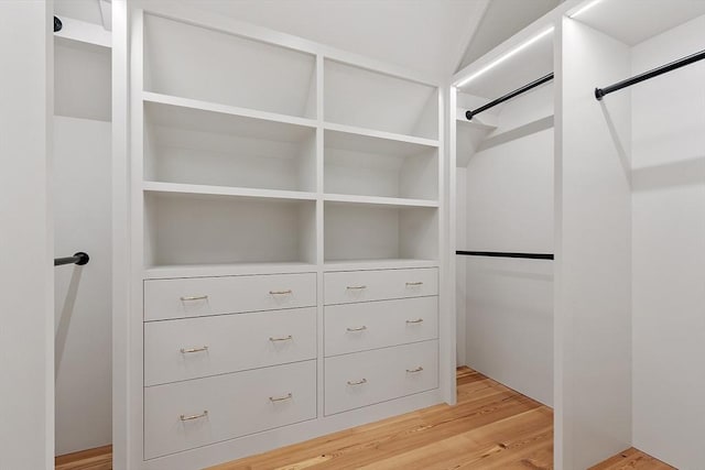 walk in closet featuring light wood finished floors
