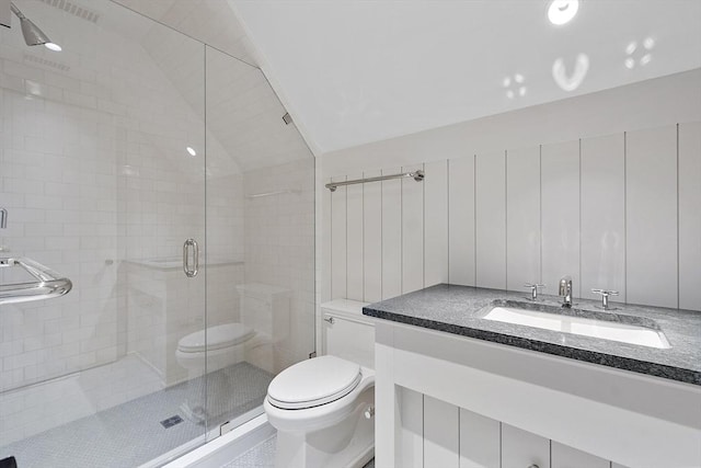 bathroom with vanity, a stall shower, lofted ceiling, and toilet