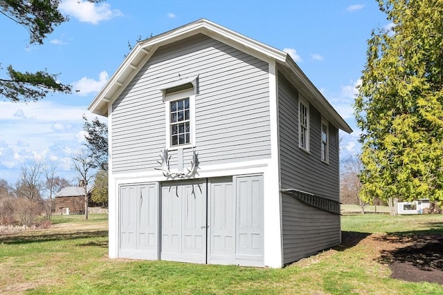 view of side of property with a lawn