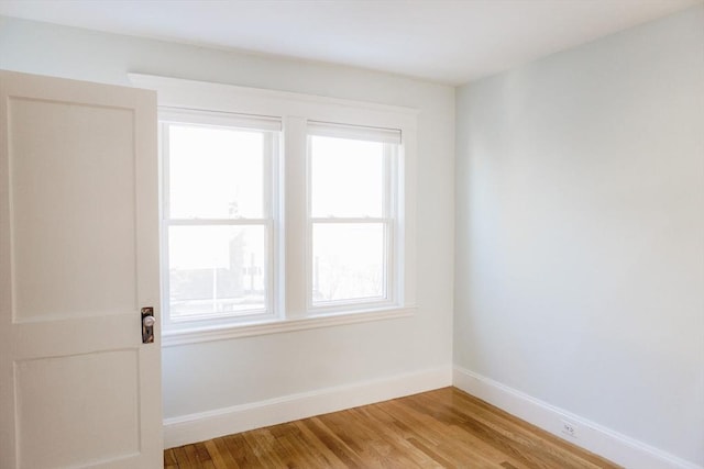 empty room with wood-type flooring