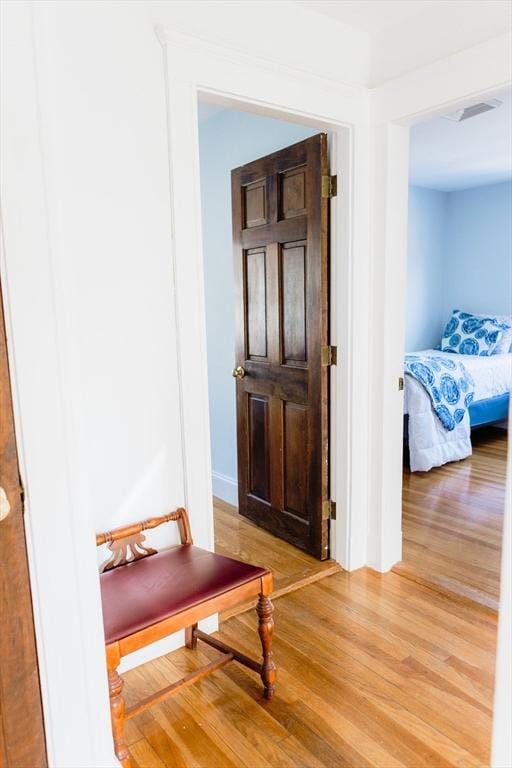 corridor featuring hardwood / wood-style floors