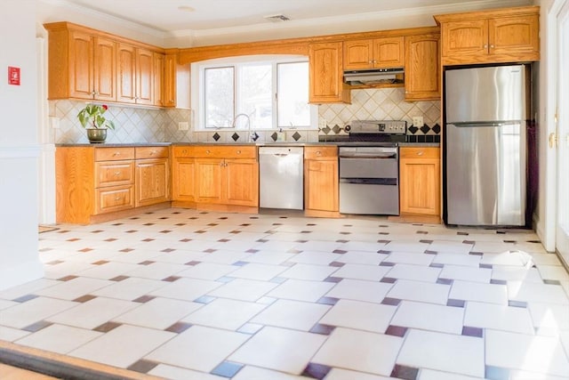 kitchen with sink, stainless steel appliances, ornamental molding, and decorative backsplash