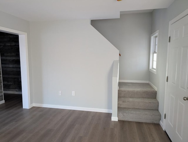 stairway featuring hardwood / wood-style floors