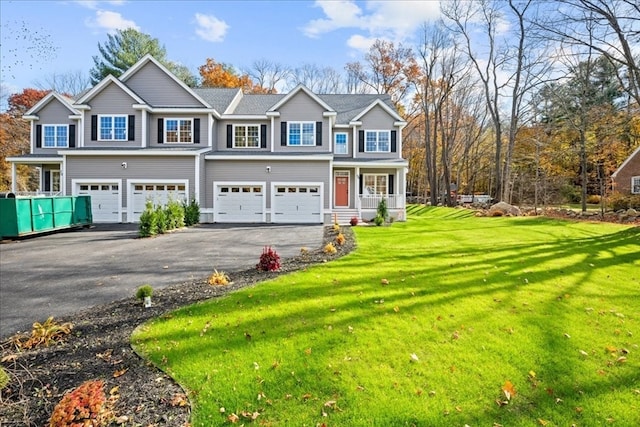 view of front of home featuring a garage and a front yard