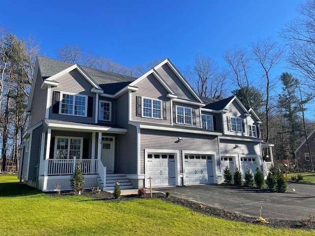 70 Princeton St, Holden, MA 01522 - view of front of property with an attached garage, a porch, a front yard, and aphalt driveway