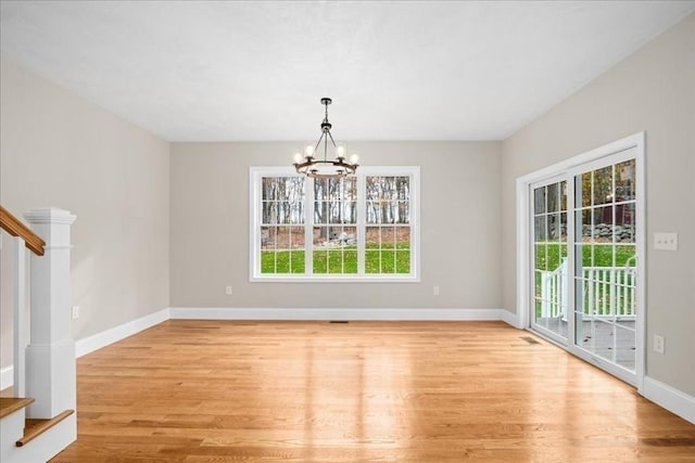 70 Princeton St, Holden, MA 01522 - unfurnished dining area with plenty of natural light, light wood-type flooring, a chandelier, and stairs