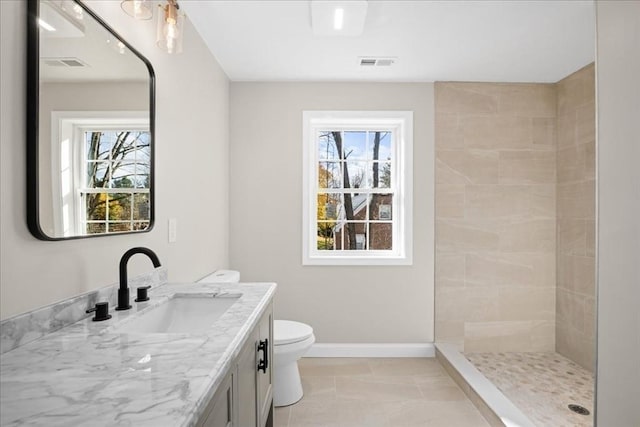 70 Princeton St, Holden, MA 01522 - full bathroom with a healthy amount of sunlight, toilet, visible vents, and a tile shower