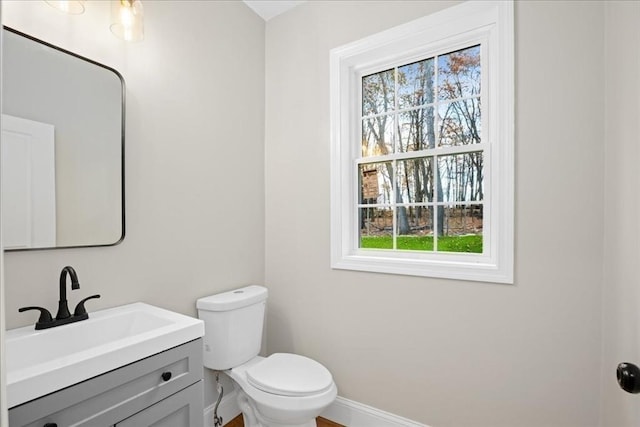70 Princeton St, Holden, MA 01522 - half bathroom featuring baseboards, toilet, and vanity