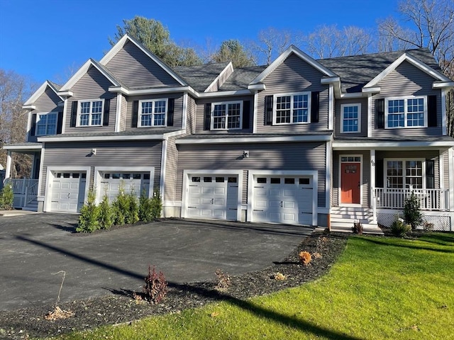70 Princeton St, Holden, MA 01522 - view of front of home featuring an attached garage, a porch, driveway, and a front yard