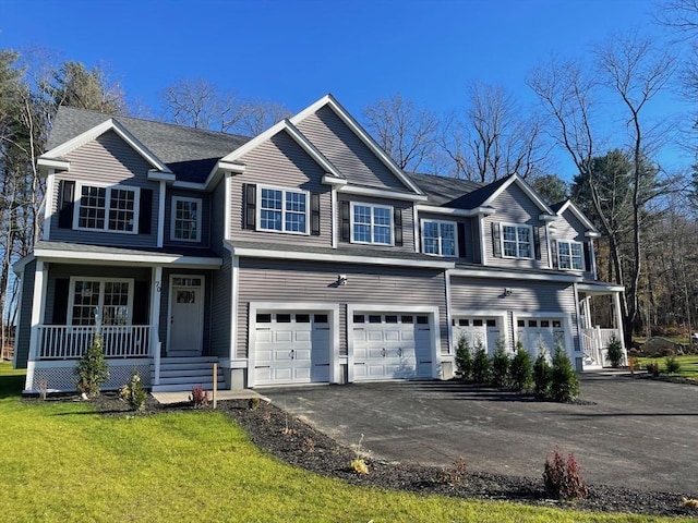 70 Princeton St, Holden, MA 01522 - view of front of house featuring an attached garage, a porch, driveway, and a front yard
