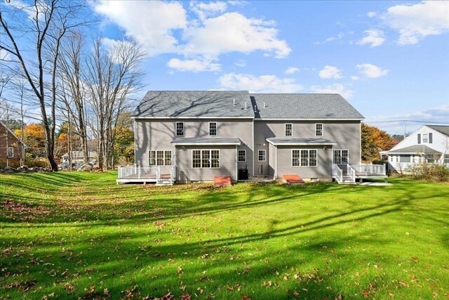 70 Princeton St, Holden, MA 01522 - rear view of house with a wooden deck and a yard