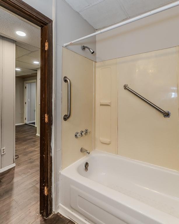 full bath featuring tub / shower combination and wood finished floors